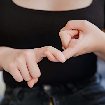 Two hands linked together, suggesting an ongoing connection