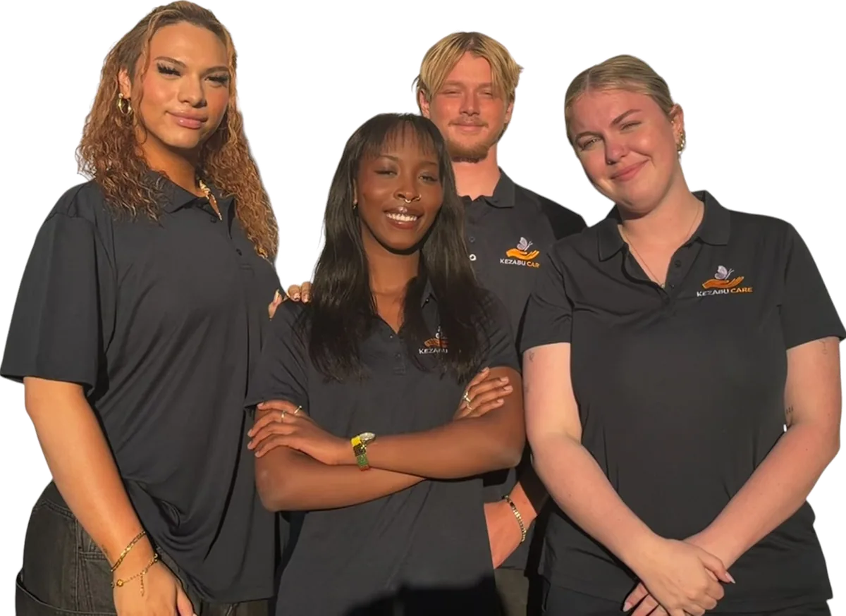 Four volunteers wearing Kezabu Care shirts