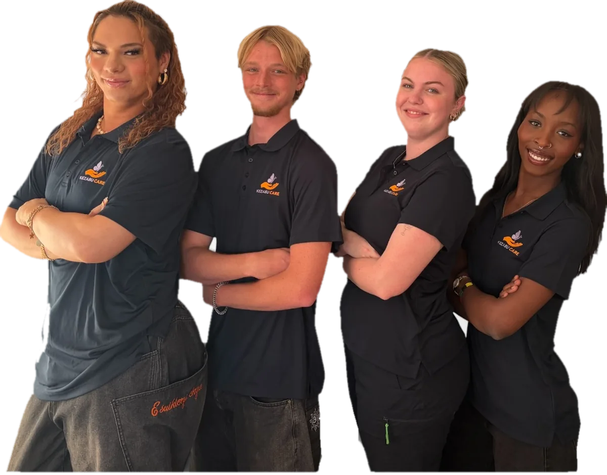 Four volunteers wearing Kezabu Care shirts